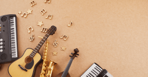 Happy World Music Day. Musical Instruments on Brown Background.